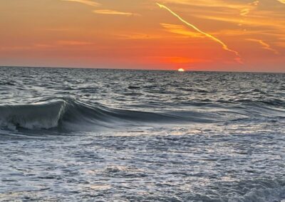 Watching the sunset in hopes of seeing the "Green Flash" as a wave rolls by